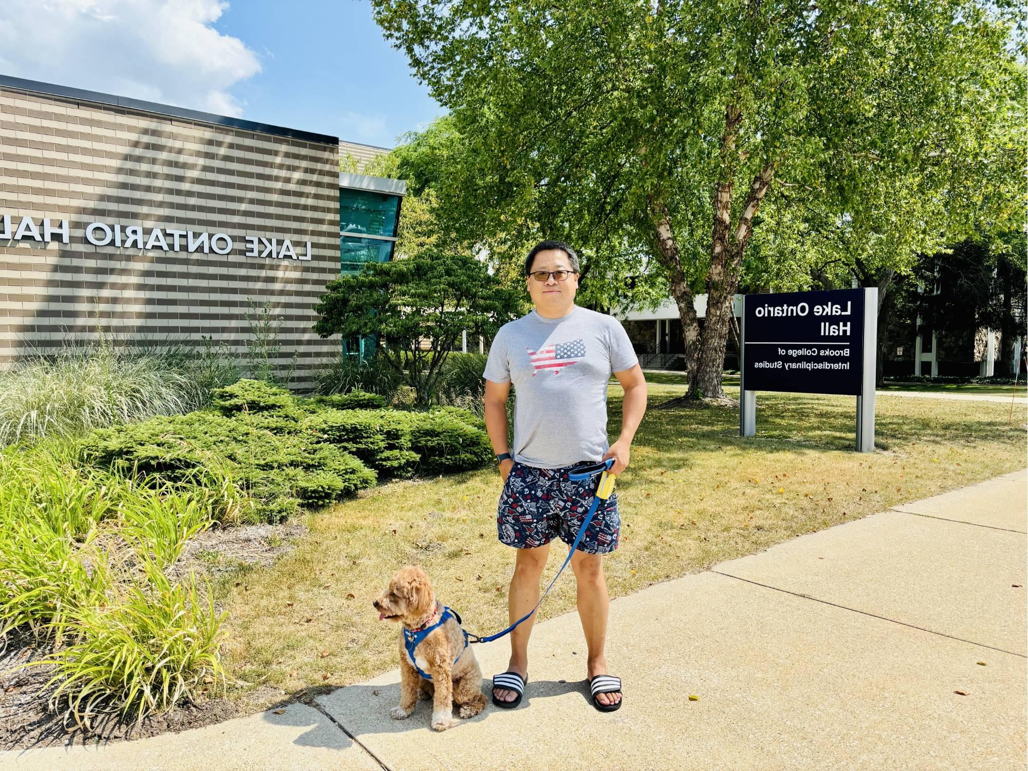 Lei Wang and his dog in front of LOH